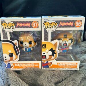 NIB Sanrio Aggretsuko Funko Pop Set of 2 with Guitar and Headphones #96 & #97